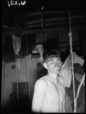 Coal miner at a bath house in Denniston