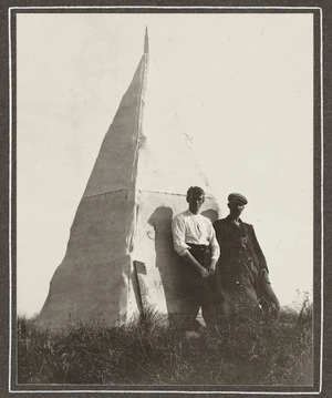 Two men by trig station on Mount Dundas, Tararua Ranges