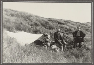 Two men by bivouac on Mitre-Holdsworth Ridge, Tararua Ranges
