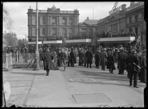 Scene in Cathedral Square, Christchurch, with crowd and trams