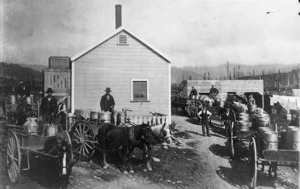 Men with horse drawn carts alongside the Hukanui Dairy Co. factory