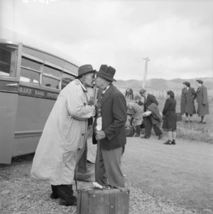 Two men greeting each other with a hongi