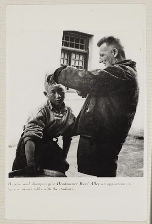 Rewi Alley cutting a boy's hair, Shandan School, Gansu, China
