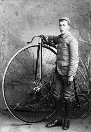 Boy with a penny farthing bicycle - Photographer unidentified