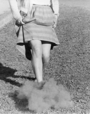 Girl kicking giant puff-ball fungus (Clavatia gigantea)