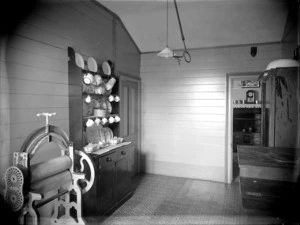 Unidentified house interior with mangle and Welsh dresser