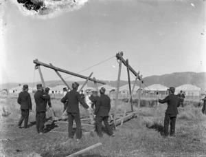 Unidentified group of soldiers working on a construction of rope and wood