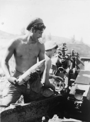 [Gunner G Horsefall standing by to reload a 25 pounder, Korea]