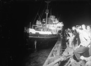 Wanganella, at night, moored alongside an unidentified wharf