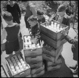 Schoolboys in Linwood, Christchurch, carrying crates of milk