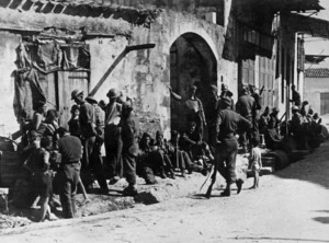 2nd NZEF soldiers resting in a village street in Crete