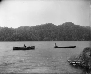 Boat and (canoe?) on Lake Otiki, Tasman district