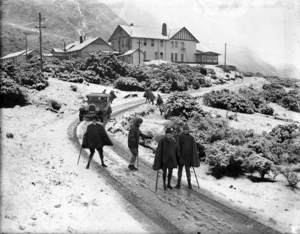 Group in the snow on the Hermitage Hotel driveway, Mount Cook