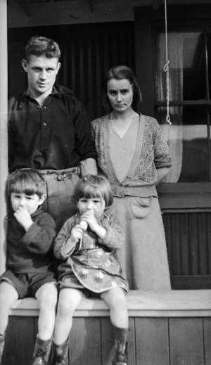 Family on the verandah of a rural house, Wellington
