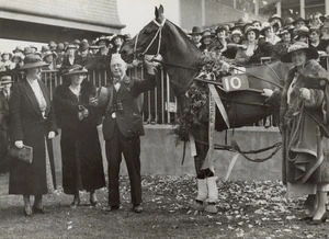 Harold Logan and his owner, Miss E Hinds, at Addington Raceway - Photograph taken by Green & Hahn