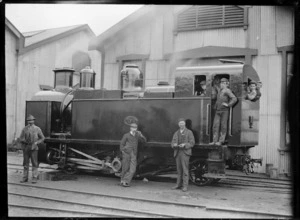 H class steam locomotive, NZR 199, 0-4-2T type, for use on the Fell system on the Rimutaka Incline, with a group of men standing on and beside the engine.