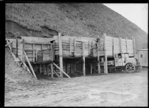 Truck collecting shingle at Owhiro Bay, Wellington