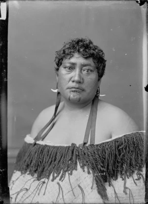Unidentified Maori woman with moko, earrings and korowai