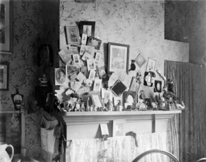 Photographs and ornaments in an unidentified bedroom