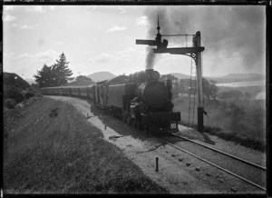 Train with a steam locomotive "Wab" class engine at a signal post, in the Dunedin area.
