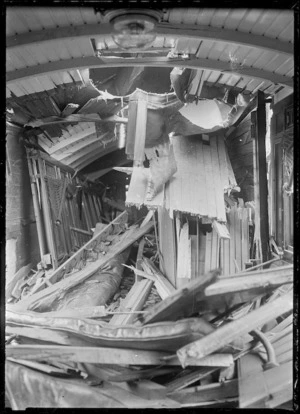 Interior view of a wrecked railway carriage after an accident.