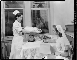 Nurse weighing a baby, Memorial Hospital, Kaitaia - Photograph taken by Edward Percival Christensen