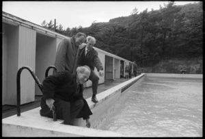 Mr C E Claridge tests the water in the Wellington College swimming pool