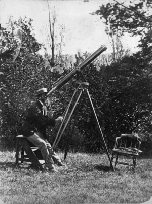 Arthur Samuel Atkinson looking through a telescope