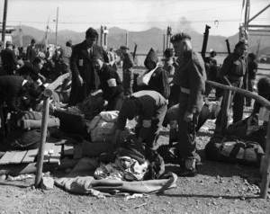 Japanese customs officers checking the baggage of Korean repatriates