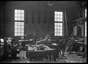 Man reading in a carpenters' workshop