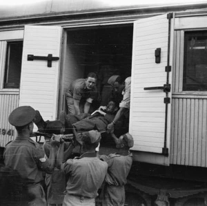 Repatriated prisoner of war being lifted on to the ambulance train at Alexandria, Egypt