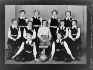 Wellington 1954 girls' intermediate representative basketball team, with cup