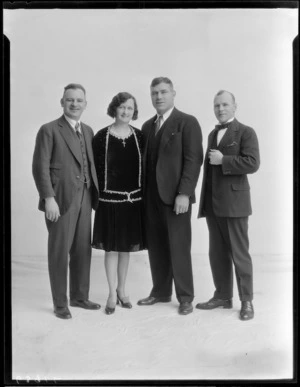Boxer Thomas Heeney with his wife Marion, [referee Alan Maxwell?] and unidentified man