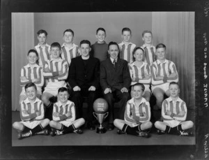 Marist Brothers Old Boys 1954 junior soccer team with trophy