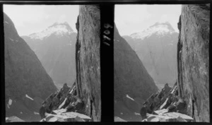 View between sheer slopes to mountain beyond, unknown location