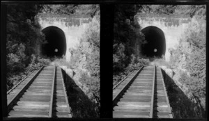 Railway track through tunnel, with the date '1923' above entrance, location unidentified