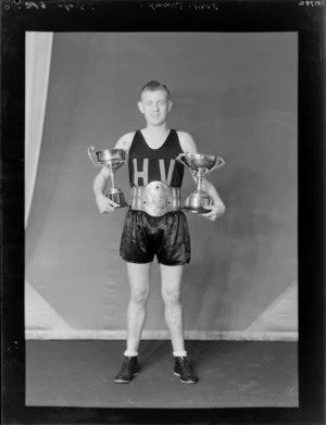 Boxer, Tommy Dunn with trophies