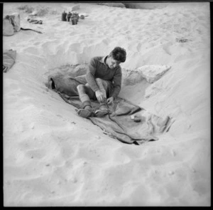 New Zealand World War 2 soldier in typical sleeping conditions in the Western Desert, North Africa