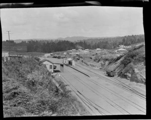 Kakahi Railway Station, rail yard and bridge, sawmill and residential houses with forest beyond, Kakahi Settlement, Manawatu-Whanganui Region