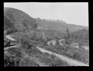 View of the Whanganui River with railway line and a road on a hillside above, Kakahi District, Manawatu-Whanganui Region