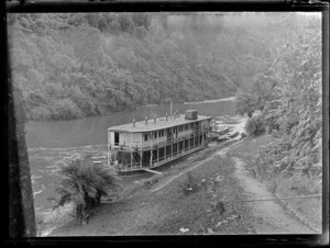 View of 'The Houseboat' moored on the Whanganui River