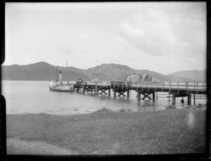 Unidentified boat docked at wharf, [Marlborough Sounds]