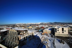 Effects of the Canterbury earthquakes of 2010 and 2011, particularly of wide views of snowy Christchurch CBD taken from roof of Alice in Videoland shop