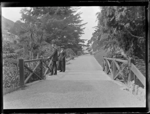 Lydia Williams with son [Edgar?] by the duck pond and sound shell, [Botanic Gardens, Wellington City?]
