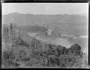 View of the [Whakapapa or Whanganui River?] surrounded by bush and forest, Kakahi Settlement, Manawatu-Whanganui Region