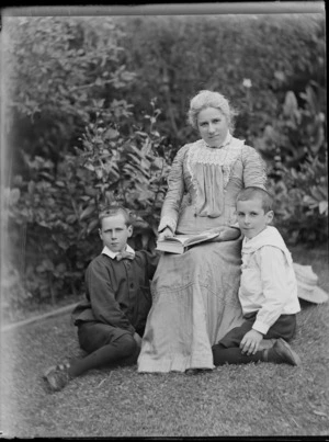 An unidentified woman [Lydia Williams' sister?], with Edgar and Owen Williams in a garden, Dunedin