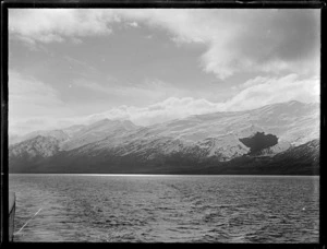 View across Lake Wakatipu from the lake steamer [Ben Lomond?] to unknown snow covered mountains, Queenstown District, Central Otago Region