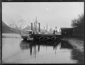 View of the Lake Wakatipu steamer Ben Lomond moored at Queenstown wharf with snow covered Cecil Peak beyond, Central Otago Region
