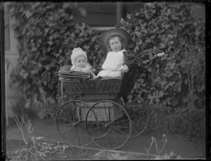 Baby Owen and a young Edgar Williams in a pram in front of the family house, 'View Bank', Maitland Street, Dunedin