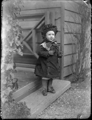 Portrait of a young Edgar Williams on the front step of the family house, 'View Bank', Maitland Street, Dunedin
